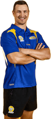 Kyle Martin in his Noble Park Football Club polo, arms folded and smiling